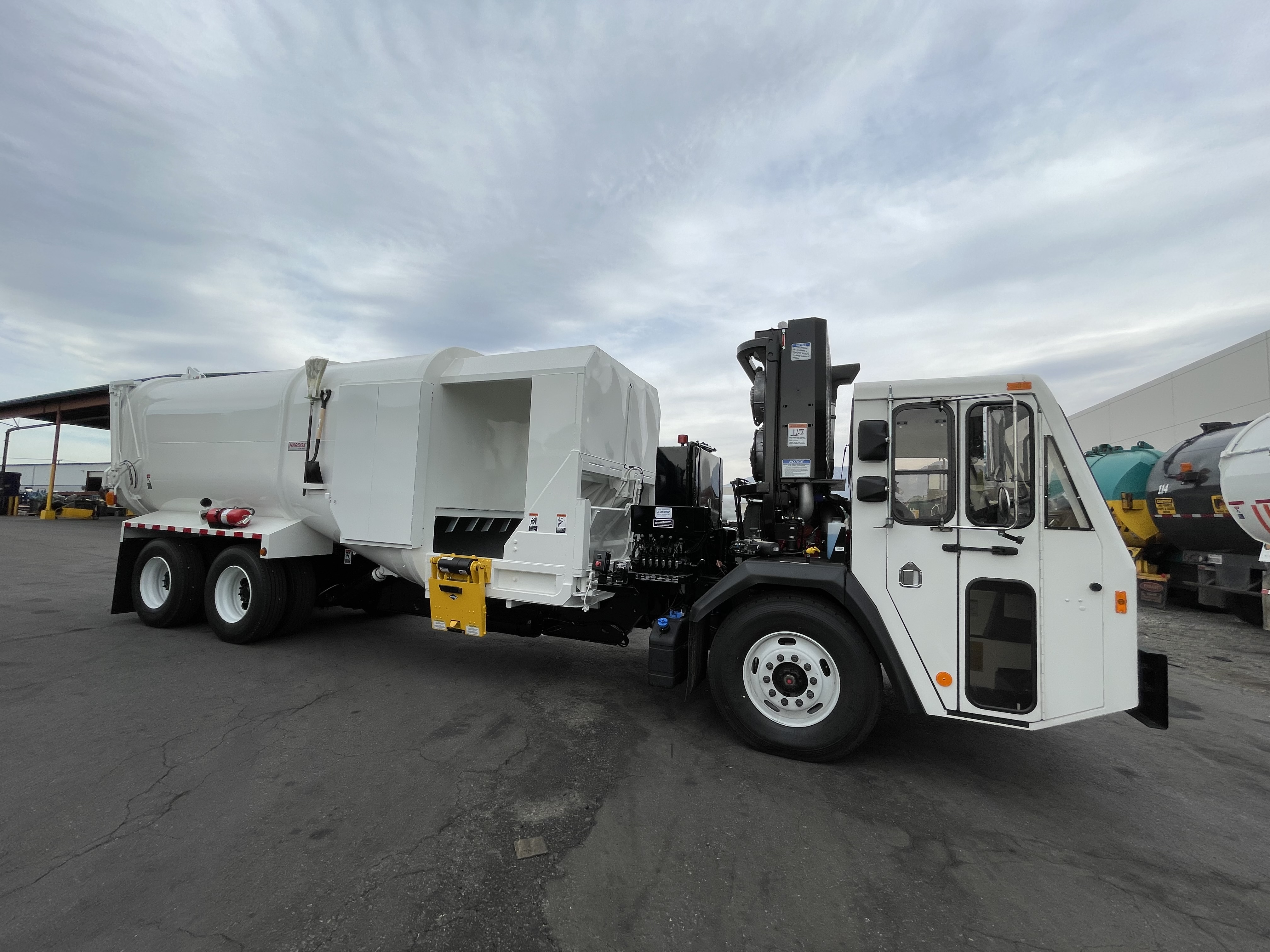 Amrep manual side loader